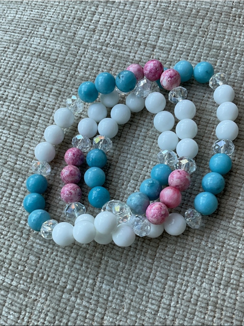 Pink blue and white bracelets